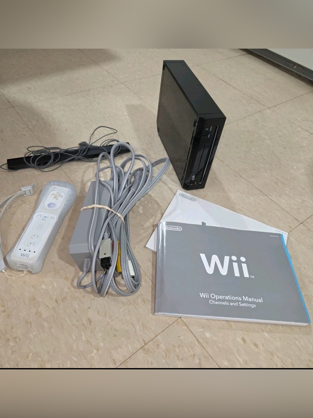 Nintendo Black Wii Console with White Remote and Gray Cables